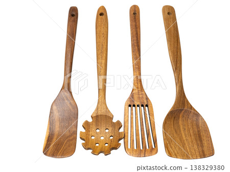 wooden kitchen spoons isolated on a white background wooden kitchen spoons isolated on a white background 138329380