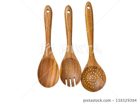 wooden kitchen spoons isolated on a white background wooden kitchen spoons isolated on a white background 138329384