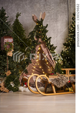 Rustic Christmas product mockup background teepee, sled and warm fairy lights 138329882