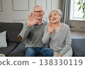 Happy senior woman man talk on video call with friends family. Mature old grandmother grandfather talking speaking with grown up children online. Older generation modern tech usage. Webcamera view 138330119