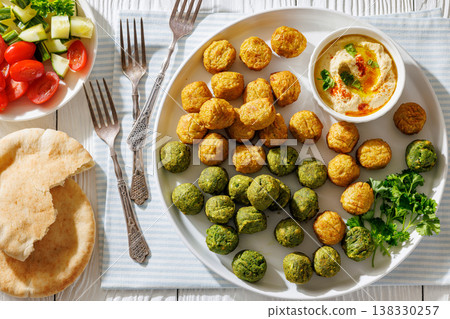 Middle eastern falafel with hummus on a plate Middle eastern falafel with hummus on a plate 138330257