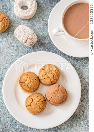 Polvorones and mantecados with hot chocolate cozy festive dessert winter scene Polvorones and mantecados with hot chocolate cozy festive dessert winter scene 138330556