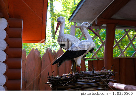 Cozy chalet stall beautifully decorated with a stork nest and fir tree branches, a magical scene  138330560