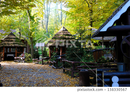 Small Cabin or Refuge, Surrounded by Pine and Deciduous Forest in Autumn Small Cabin or Refuge, Surrounded by Pine and Deciduous Forest in Autumn 138330567