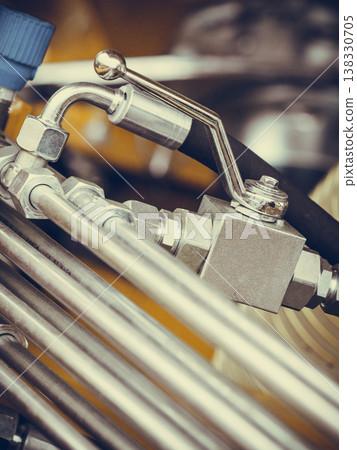 Pneumatic, hydraulic machinery made of steel closeup Pneumatic, hydraulic machinery made of steel closeup 138330705