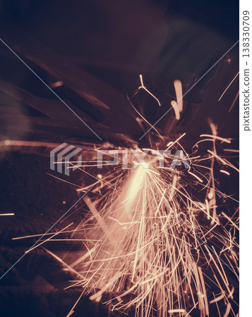 Laser cutting steel metal with bright sparks Laser cutting steel metal with bright sparks 138330709