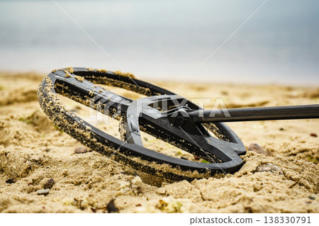 metal detector on sea beach metal detector on sea beach 138330791