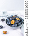 Fresh plums in a clay bowl. 138331090