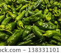 Top view of fresh organic green Padron peppers background pattern at farmers market 138331101