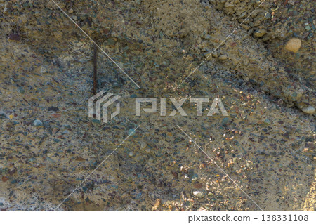 Reinforced concrete texture, exposed rebar, aggregate surface, construction detail Reinforced concrete texture, exposed rebar, aggregate surface, construction detail 138331108