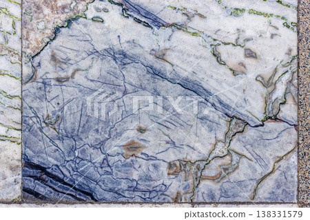 Worn Marble Floor Tiles with Intricate Blue and Green Veins 138331579