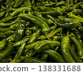 Top view of fresh organic hot green chili peppers background pattern at farmers market 138331688
