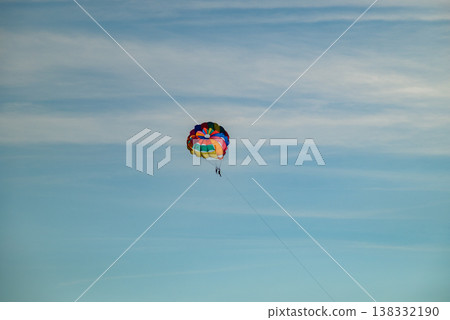 Colorful parasailing canopy in blue sky with copy space 138332190