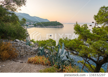 Serene coastal Makarska bay on Adriatic sea at sunrise in Makarska, Croatia Serene coastal Makarska bay on Adriatic sea at sunrise in Makarska, Croatia 138332207