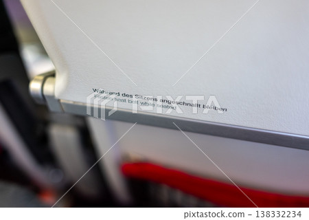 Tray table safety instruction on Austrian airlines airplane Tray table safety instruction on Austrian airlines airplane 138332234