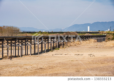 Kamitsuya Bridge (Nagarebashi), a famous landmark in Yawata City, Kyoto Prefecture. Kamitsuya Bridge (Nagarebashi), a famous landmark in Yawata City, Kyoto Prefecture. 138333213