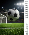 Pixelated Soccer Ball In Flight Towards Goal Against Lit Stadium Green Grass Foreground 138333872