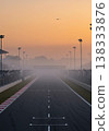 Race Track With Fog During Sunrise Offering Atmospheric View In Morning Light 138333876
