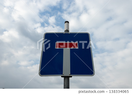 Dead End Road Sign Against Cloudy Sky 138334065