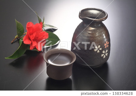 Japanese sake and snow camellia 138334628
