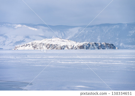Scenery view of frozen lake Baikal in winter season, the surface of lake covered by snow. Lake Baikal is the world's deepest lake located in southern Siberia, Russia. 138334651