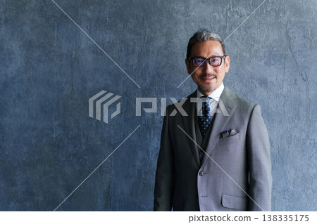 Portrait of a business person in their 50s (middle-aged/senior). Portrait of a business person in their 50s (middle-aged/senior). 138335175