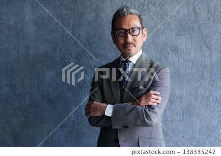 Portrait of a business person in their 50s (middle-aged/senior). Portrait of a business person in their 50s (middle-aged/senior). 138335242