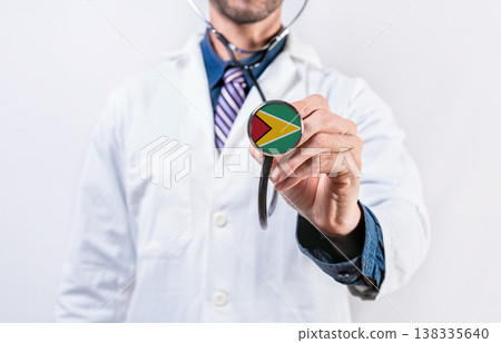 Guyana healthcare system, doctor holding stethoscope. Guyana health and medical insurance concept Guyana healthcare system, doctor holding stethoscope. Guyana health and medical insurance concept 138335640