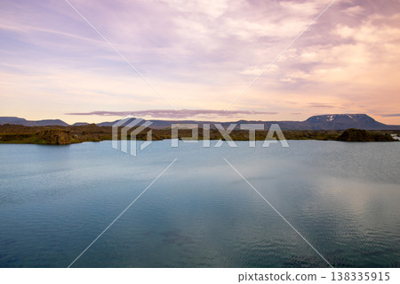 Sunset over Lake Mývatn, a volcanic lake in northern Iceland, a Nordic island nation, also known for its false crater. Sunset over Lake Mývatn, a volcanic lake in northern Iceland, a Nordic island nation, also known for its false crater. 138335915