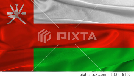 Flag of Oman with fabric textured background. Close up of National flag of Oman with realistic texture Flag of Oman with fabric textured background. Close up of National flag of Oman with realistic texture 138336102