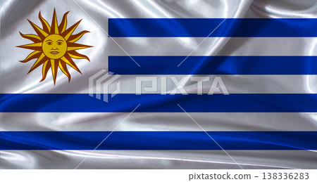 Uruguay flag with cloth textured background. National flag of Uruguay with realistic texture Uruguay flag with cloth textured background. National flag of Uruguay with realistic texture 138336283