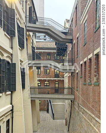 Historic architecture with external staircases and brick buildings in an urban setting Historic architecture with external staircases and brick buildings in an urban setting 138337203