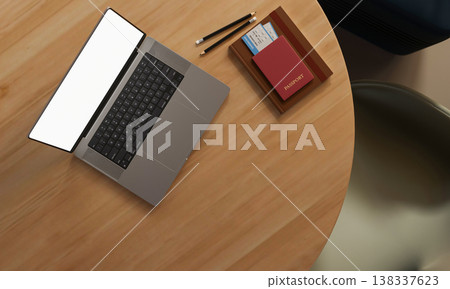Top view of white screen laptop with boarding pass in passport book and pencil on round wooden table Top view of white screen laptop with boarding pass in passport book and pencil on round wooden table 138337623
