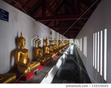 Golden buddha statue temple corridor thailand architecture religious interior Golden buddha statue temple corridor thailand architecture religious interior 138338083