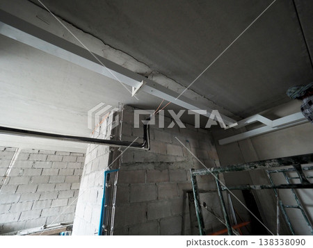 Construction ceiling crack exposed wiring concrete beam unfinished wall safety risk 138338090