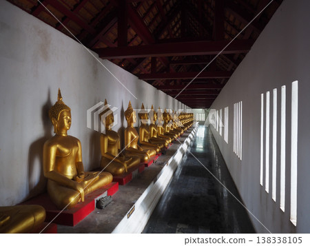 Buddha statue row temple corridor meditation serenity Buddha statue row temple corridor meditation serenity 138338105