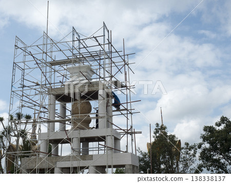 Temple construction scaffolding worker statue renovation tower sky outdoor structure 138338137