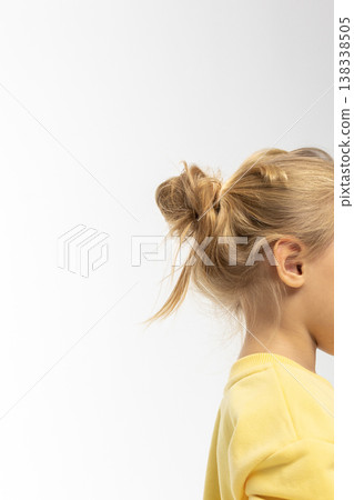 Portrait of beautiful cute little toddler girl. Child with funny face in yellow sweatshirt. Pretty smile kid in studio on white background. High quality photo Portrait of beautiful cute little toddler girl. Child with funny face in yellow sweatshirt. Pretty smile kid in studio on white background. High quality photo 138338505