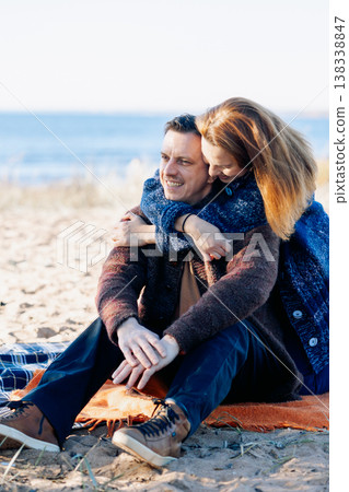 Portrait happy beautiful couple in love enjoying autumn picnic in autumn park. Vertical photo. High quality photo 138338847