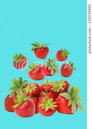 Fresh strawberries in a stack with some floating above 138338995