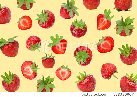 Strawberries of various sizes placed on a yellow surface Strawberries of various sizes placed on a yellow surface 138339007