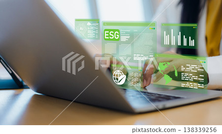 ESG environmental social and governance sustainable business concept.Green technology and renewable energy investment strategy.Businesswoman analyzing ESG data and AI technology on laptop. 138339256