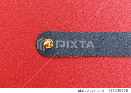 shiny red leather background with dark blue strap shiny red leather background with dark blue strap 138339566