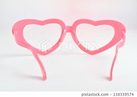 pink heart shape of glasses on white background 138339574