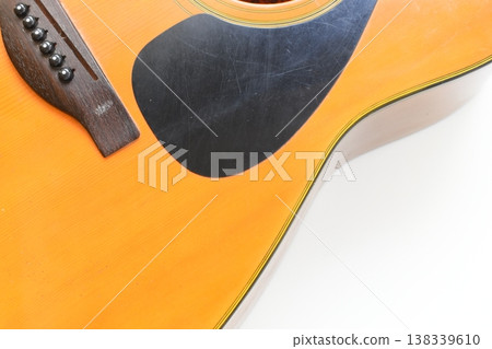 part of brown wood acoustic guitar isolated on white background 138339610