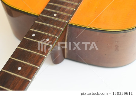 brown wood acoustic guitar isolated on white background 138339611