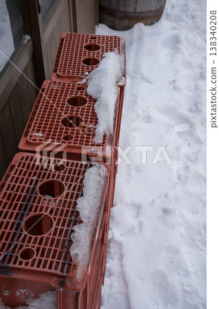 Snow and red beer crates 138340208