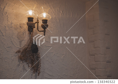 Antique lighting and dried flowers: Wall decor Antique lighting and dried flowers: Wall decor 138340322