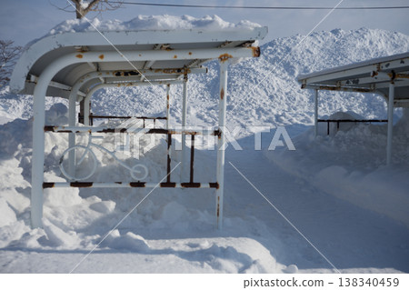 Bicycle parking area buried in snow 138340459