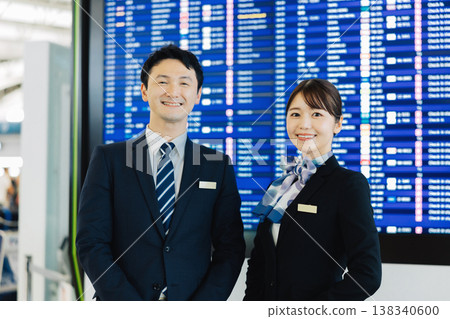 Airport ground staff (male and female) providing guidance. "Filming cooperation: Kansai International Airport (KIX)" Airport ground staff (male and female) providing guidance. "Filming cooperation: Kansai International Airport (KIX)" 138340600